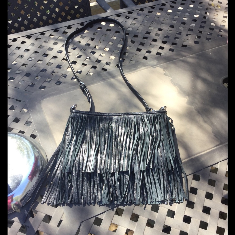 Awesome real leather fringe crossbody style purse.